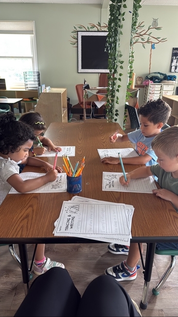 Children working together at a classroom table