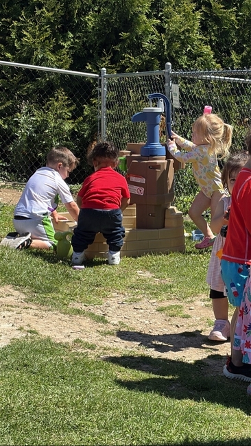 Children enjoying outdoor play at Love2Learn