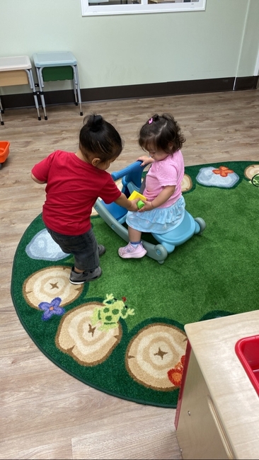 Toddlers playing together in a Love2Learn classroom